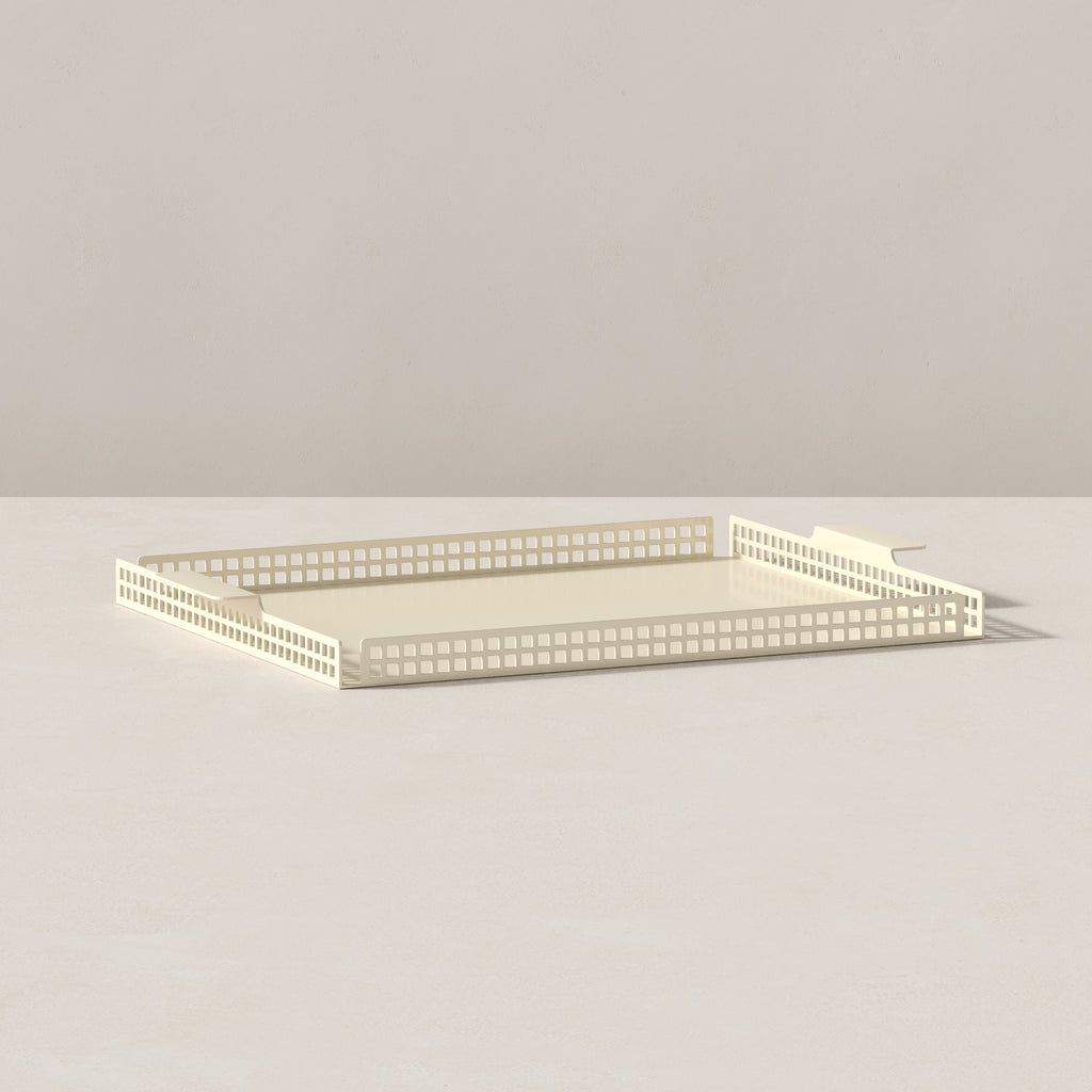 End view of butter cream Art Deco serving tray highlighting geometric perforated detailing