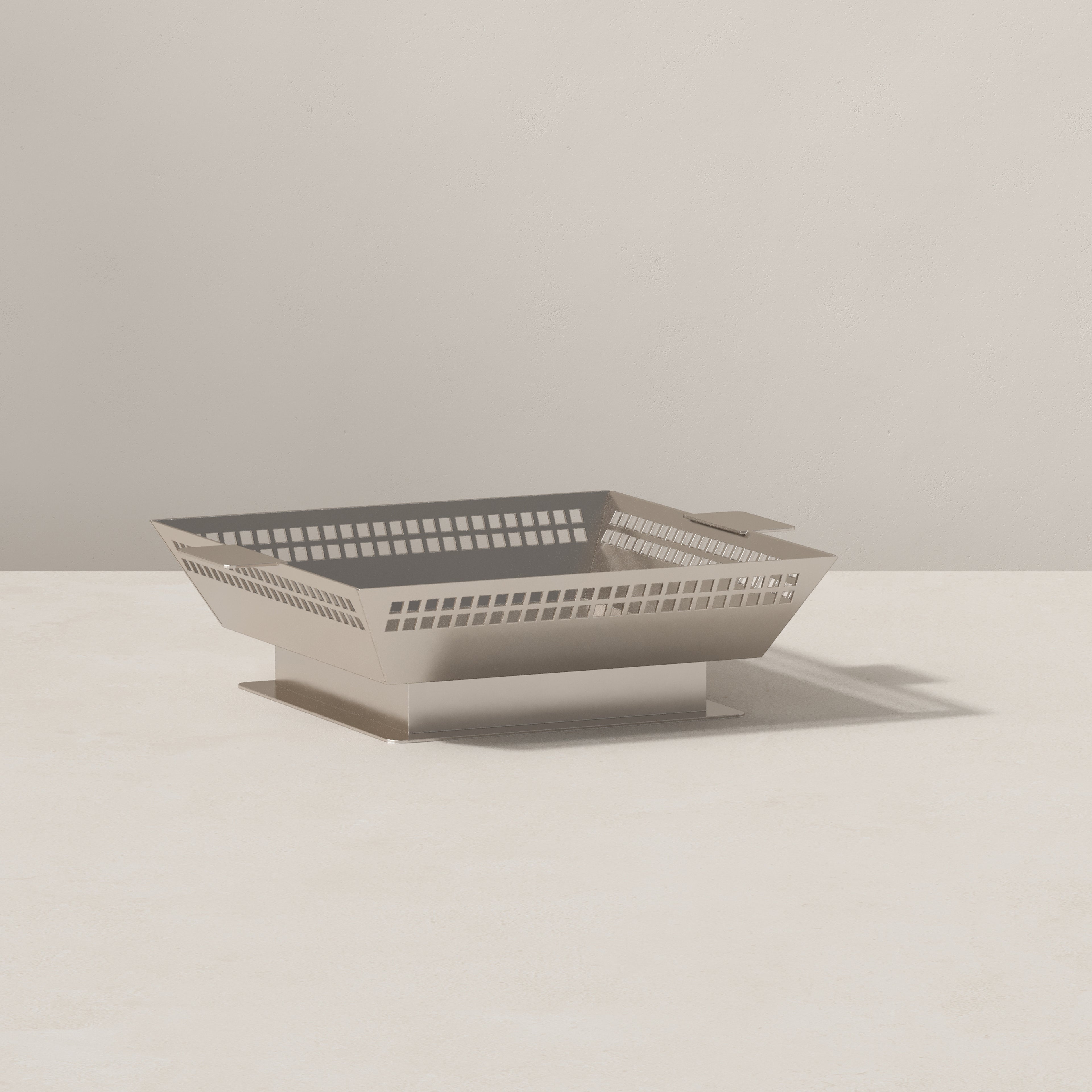 Angled view of Vera Jean Art Deco metal fruit vessel with geometric perforations