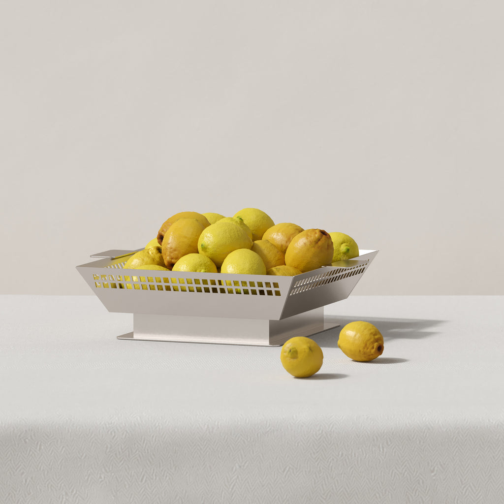 Vera Jean Art Deco metal fruit vessel styled with lemons on a neutral surface