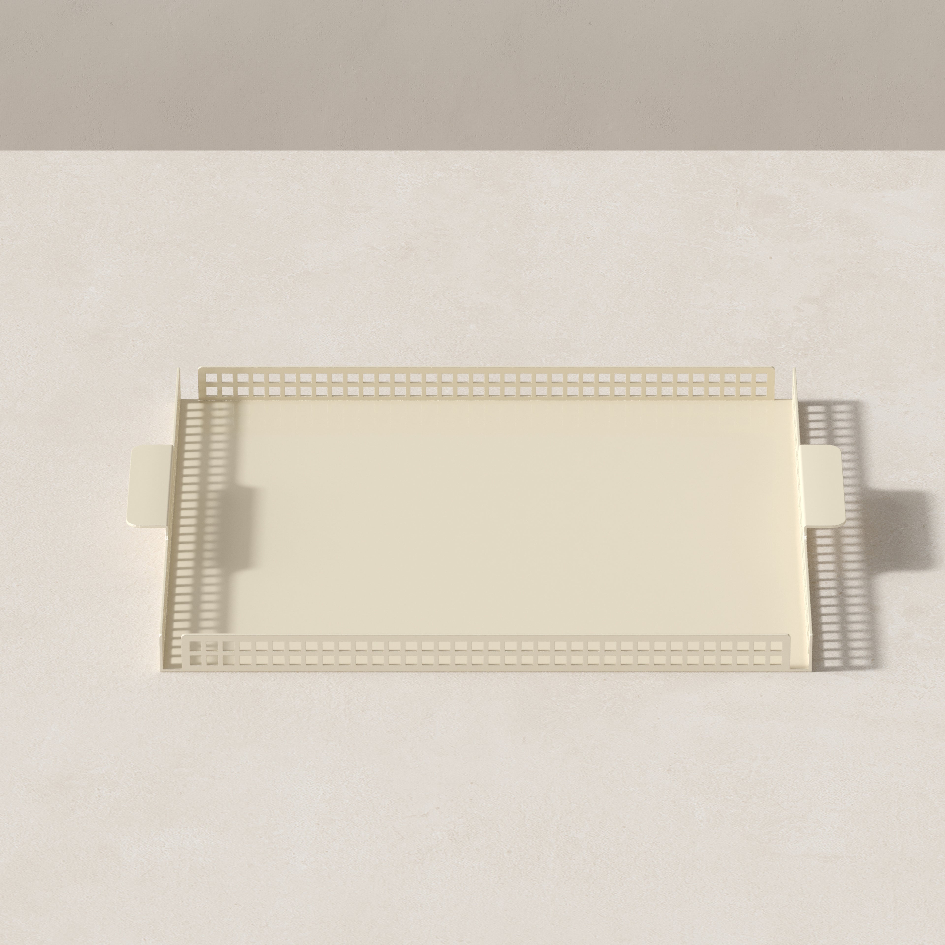 Top view of butter cream Art Deco serving tray with rectangular shape and perforated border