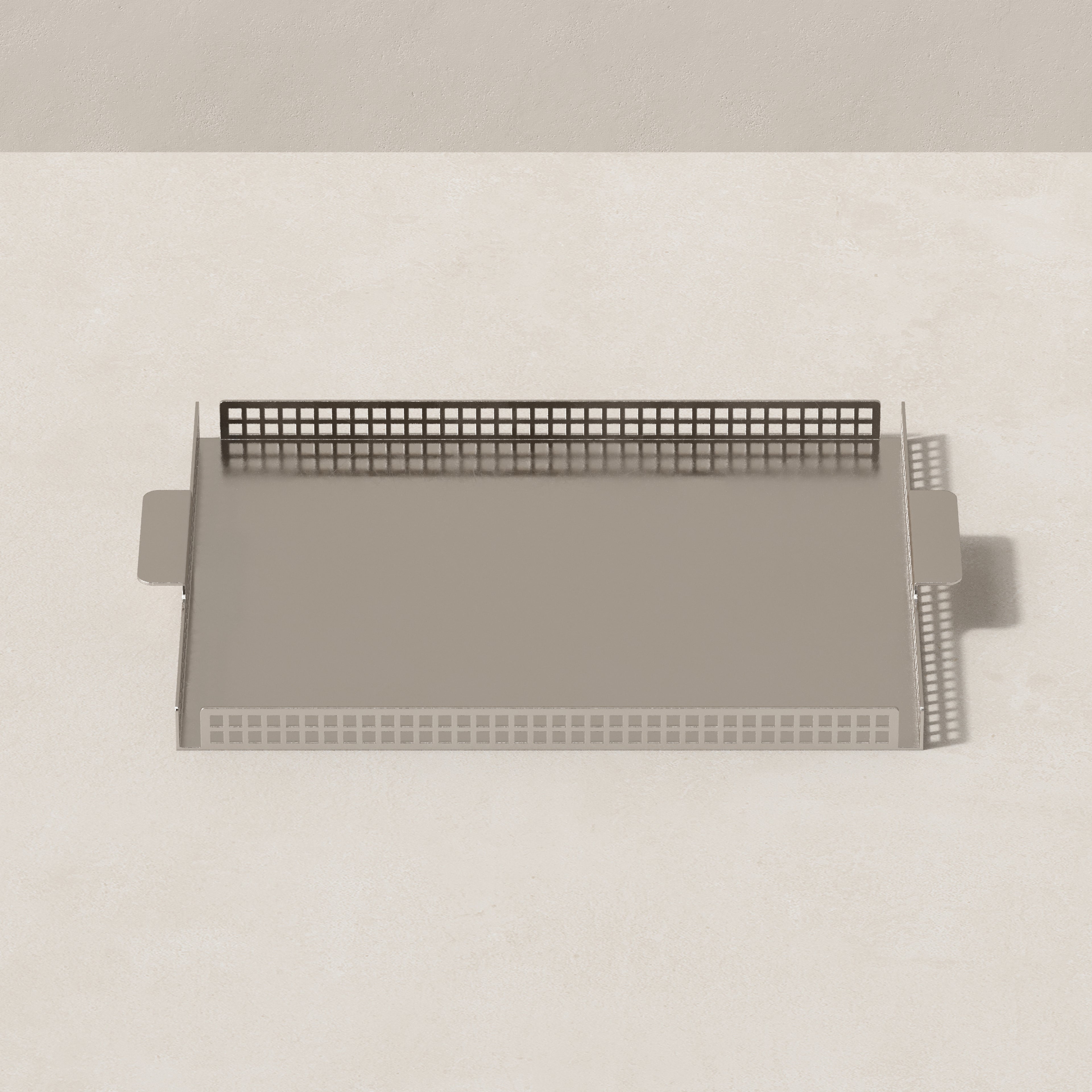 Top view of Art Deco nickel serving tray with rectangular form and perforated steel border