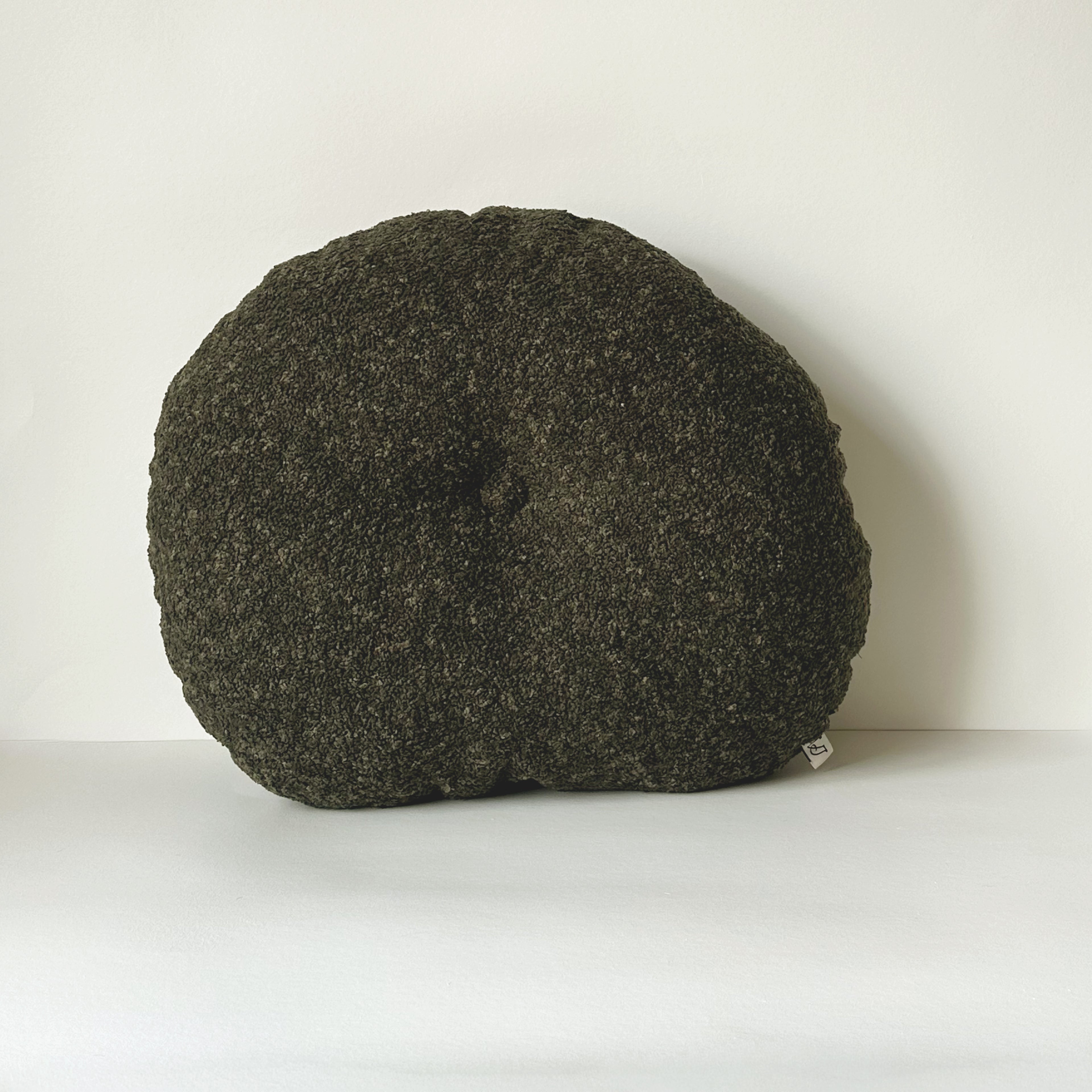 Cloud Cushion in moss bouclé shown from the side