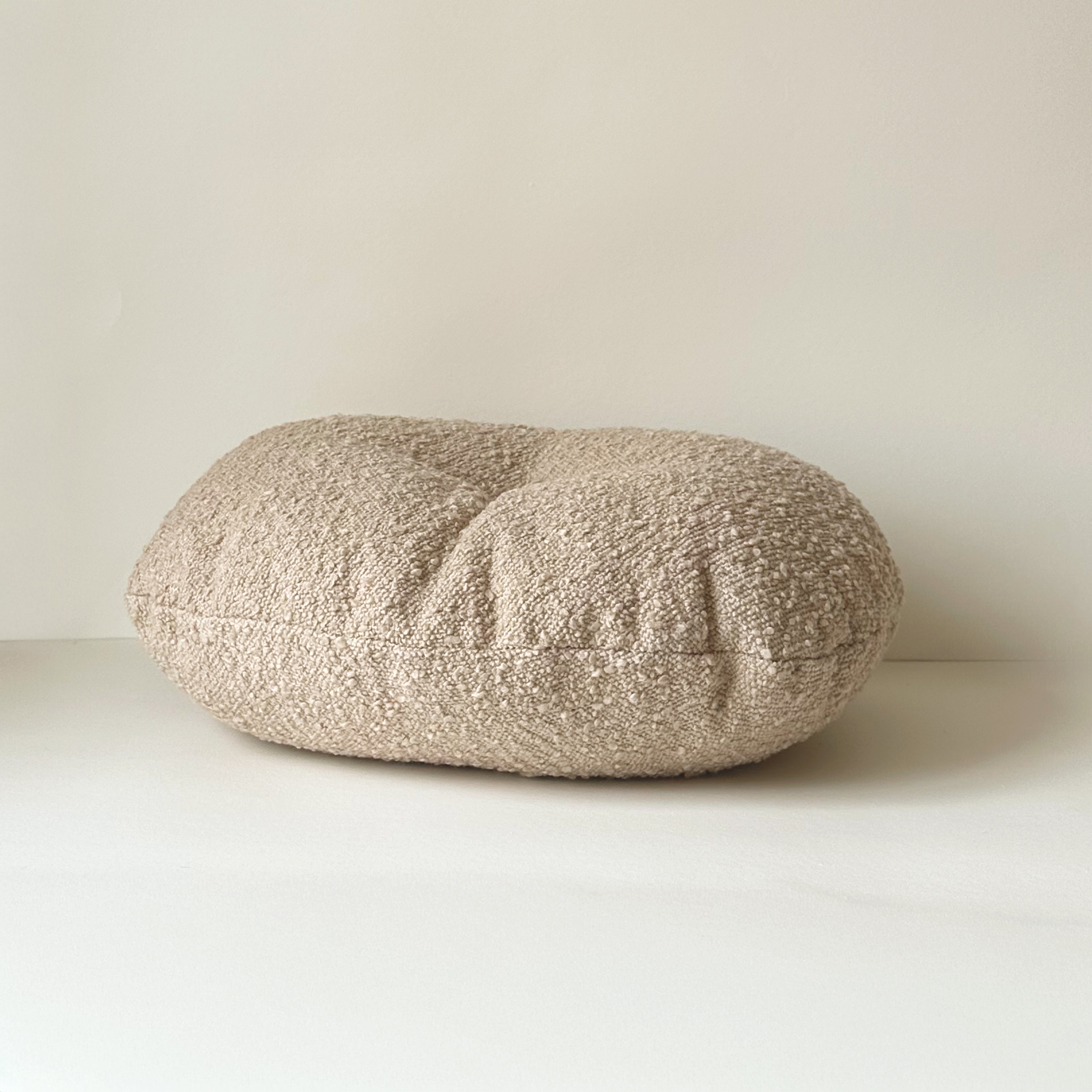 Side view of Cloud Cushion in oatmeal textured bouclé