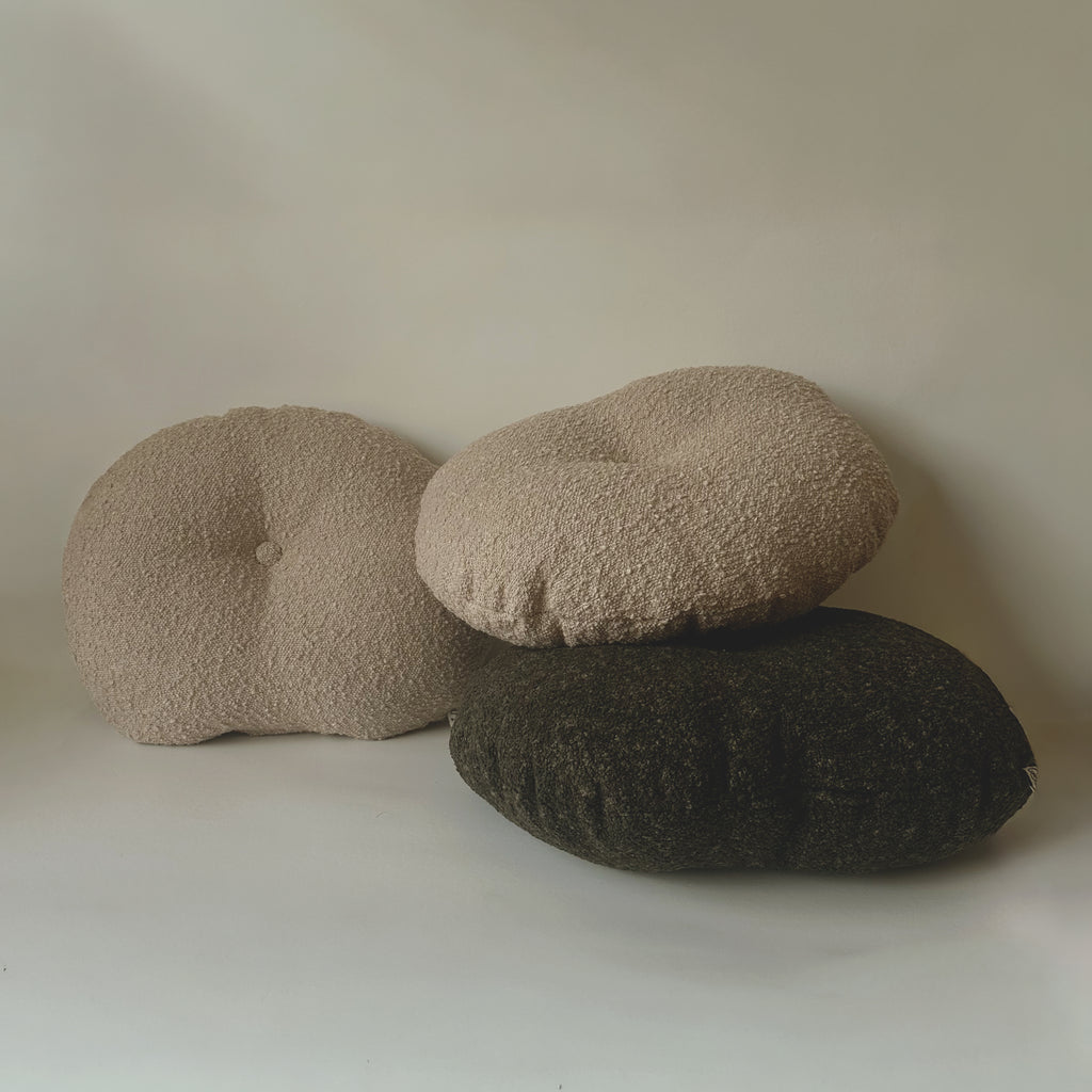 Cloud Cushions in oatmeal, natural, and forest tones grouped together